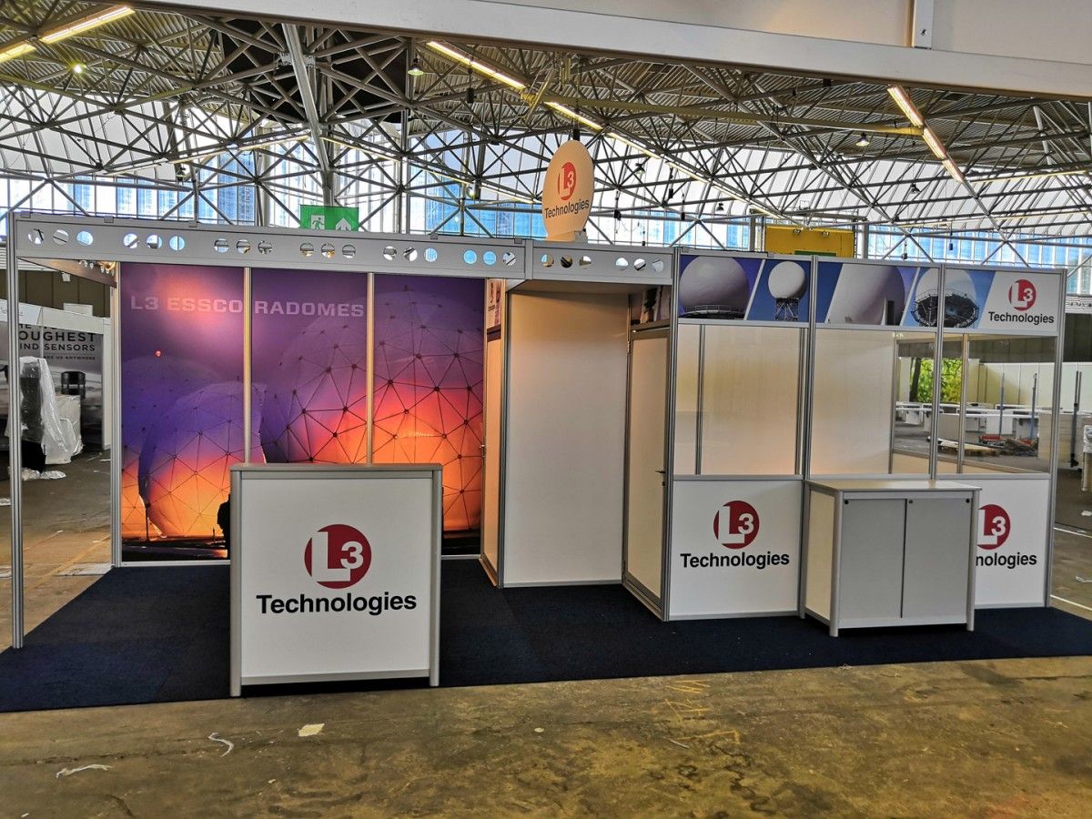 Exhibition stand buildup at RAI Amsterdam, featuring a modern and modern stand design by Adam Expo Stand, with a sleek and modern booth setup, showcasing a company's products and services at a trade show or exhibition.