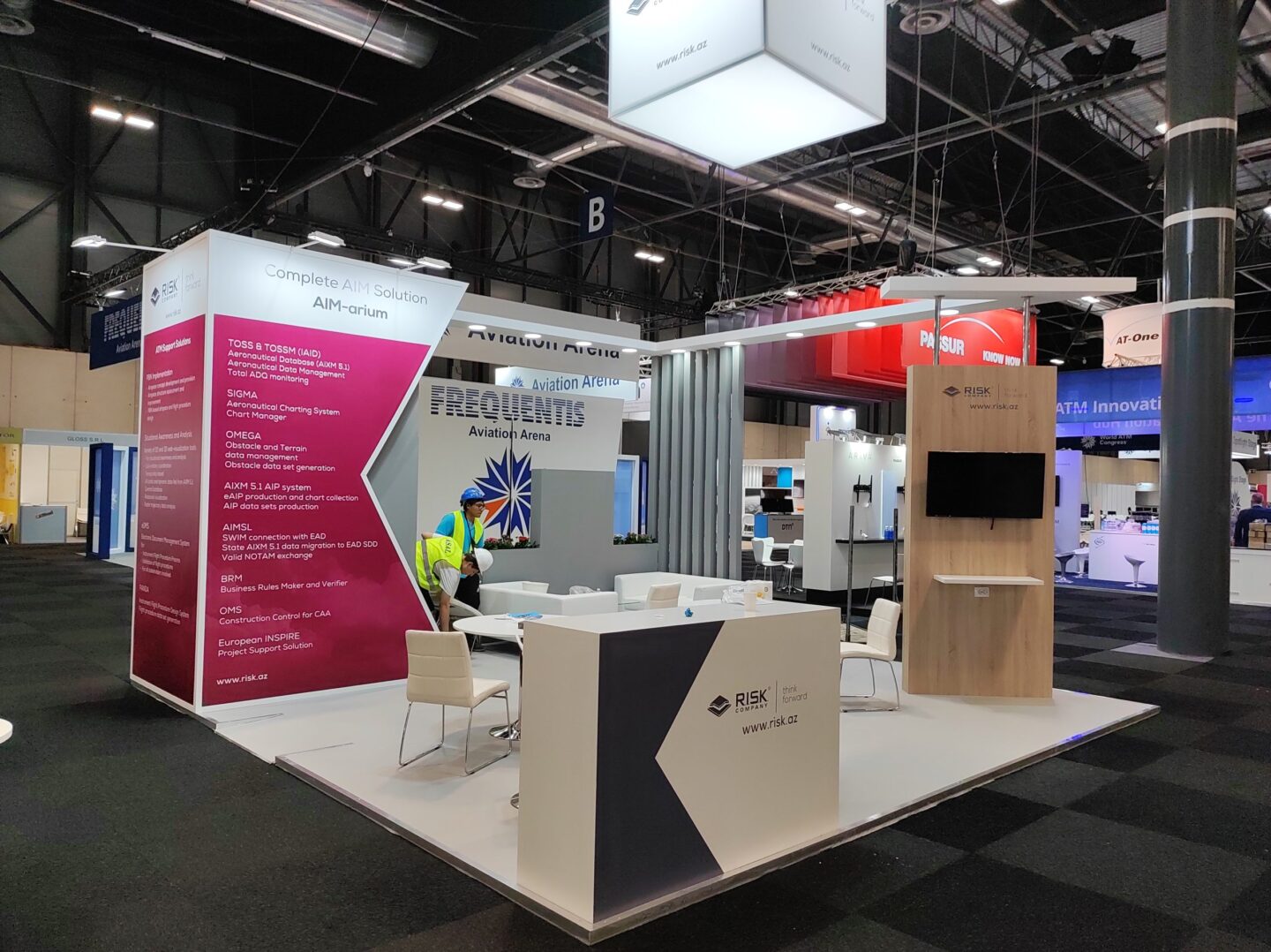 Exhibition booth builder and contractor designing and constructing a custom trade show stand with modern architecture and interactive displays, showcasing expertise in exhibition stand design and build services for global events and conferences.